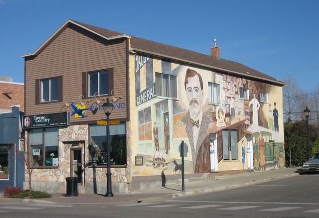 A building with a mural of a man on the side.